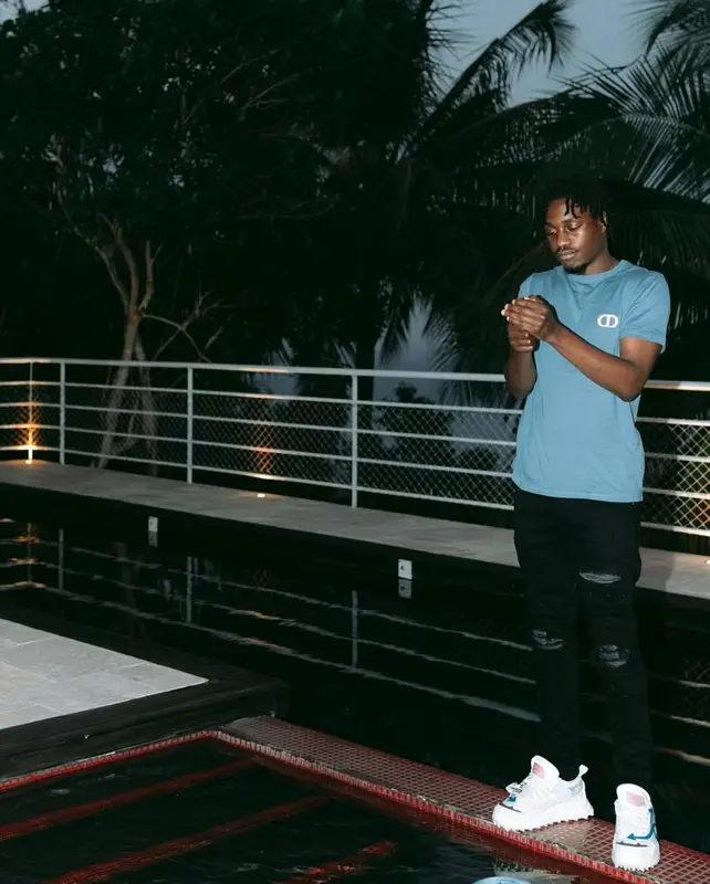 Lil Tjay outfit in Dior, Amiri, and Off-White, 2021