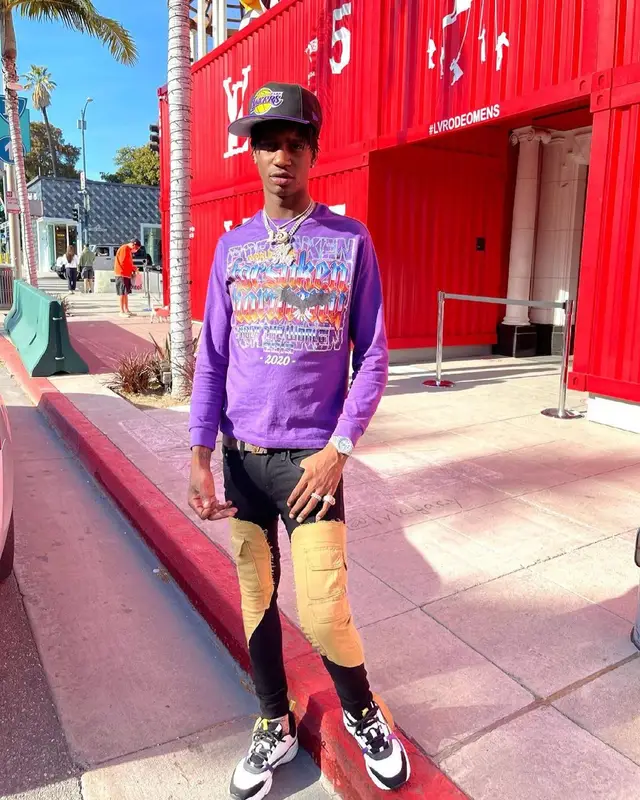 Yung Mal outfit in Dior, Louis Vuitton, and New Era, 2021
