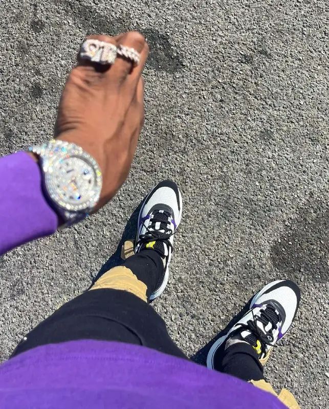 Yung Mal outfit in Dior, Louis Vuitton, and New Era, 2021