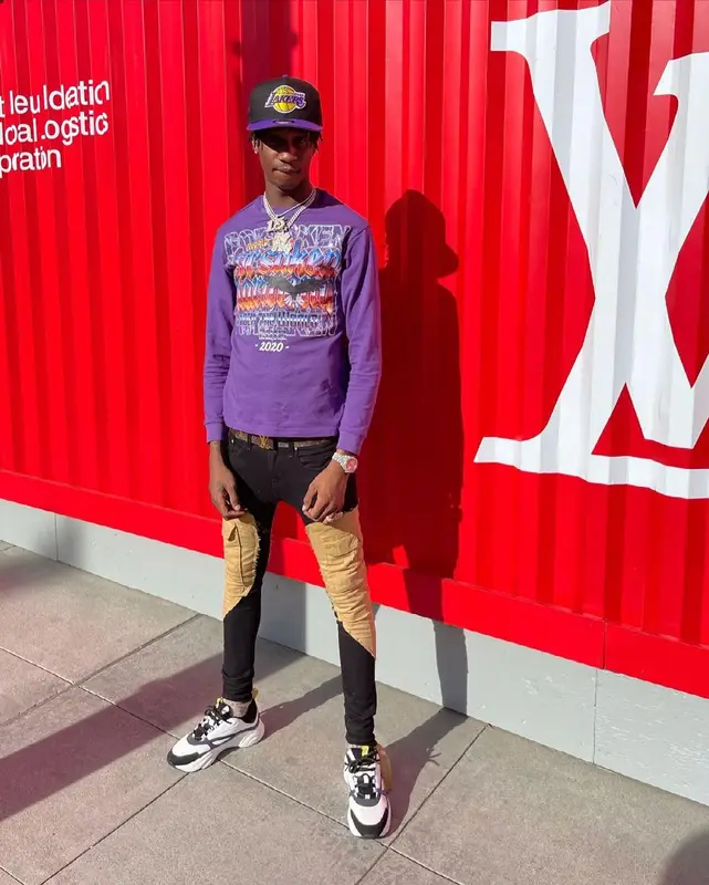 Yung Mal outfit in Dior, Louis Vuitton, and New Era, 2021