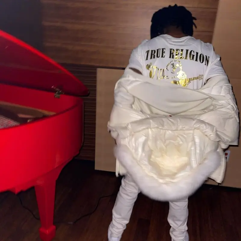 Lil Uzi Vert outfit in Moncler, True Religion, and Nike, 2021