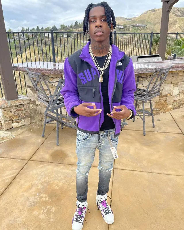 Polo G outfit in Supreme, Purple Brand, and The North Face, 2021