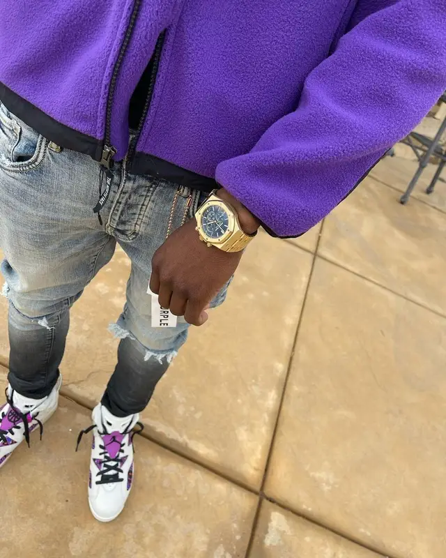 Polo G outfit in Supreme, Purple Brand, and The North Face, 2021
