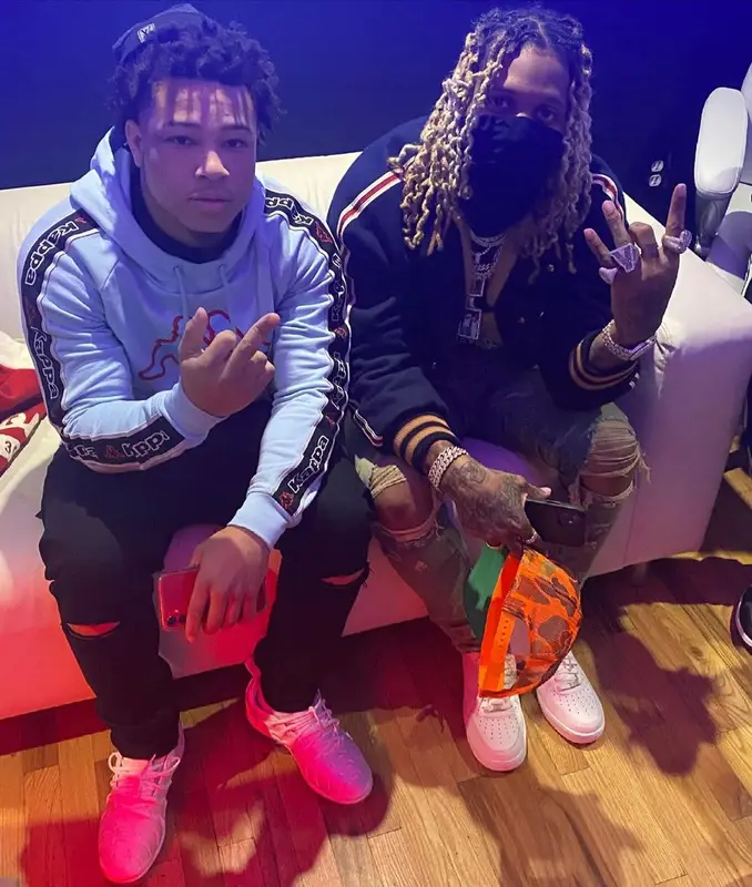 Lil Durk outfit in Gucci, Amiri, and Disney, 2021