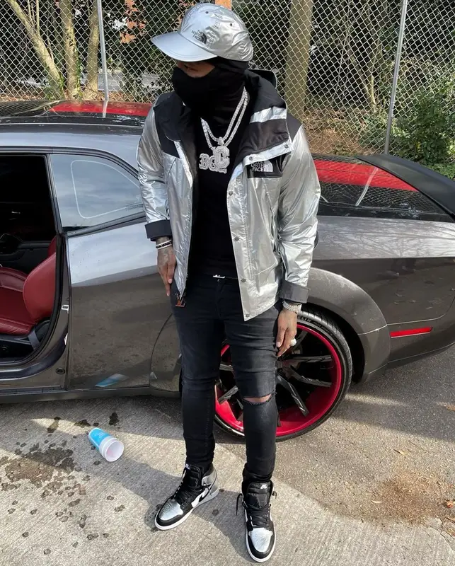 Moneybagg Yo outfit in Louis Vuitton, Supreme, and The North Face, 2021