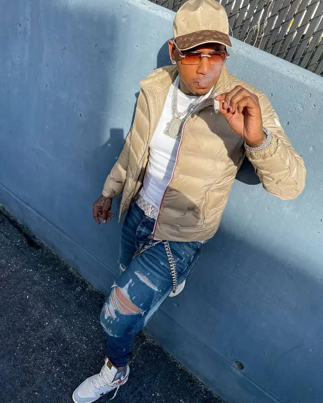 Moneybagg Yo outfit in Moncler, Cartier, and Louis Vuitton, 2021