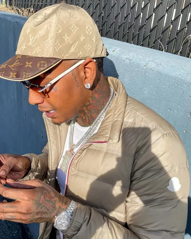 Moneybagg Yo outfit in Moncler, Cartier, and Louis Vuitton, 2021