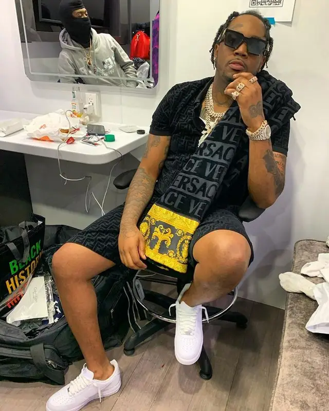 Fivio Foreign outfit in Fendi, Louis Vuitton, and Versace, 2021