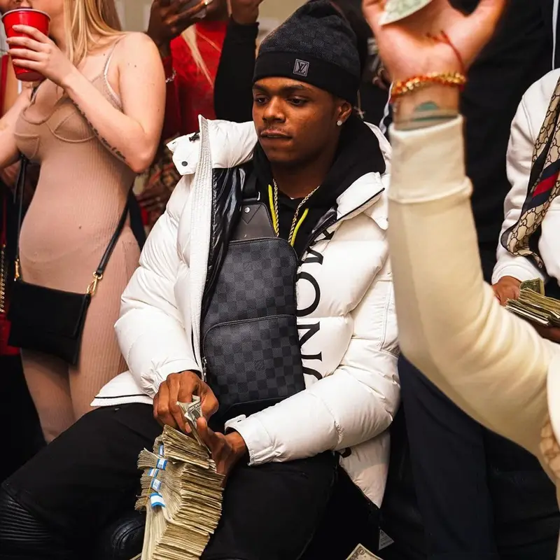 TJ Porter outfit in Moncler, Amiri, and Louis Vuitton, 2021