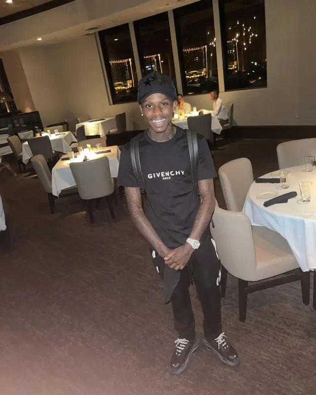 Quando Rondo outfit in Givenchy, Louis Vuitton, and Amiri, 2021