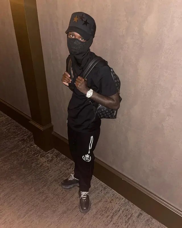 Quando Rondo outfit in Givenchy, Louis Vuitton, and Amiri, 2021