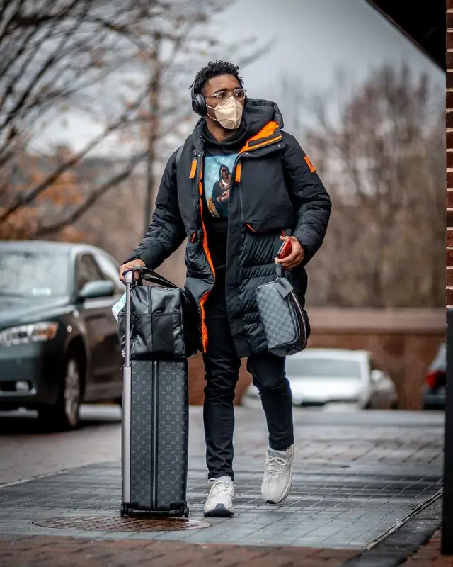 Donovan Mitchell outfit in Adidas, Louis Vuitton, and Retrosuperfuture, 2021