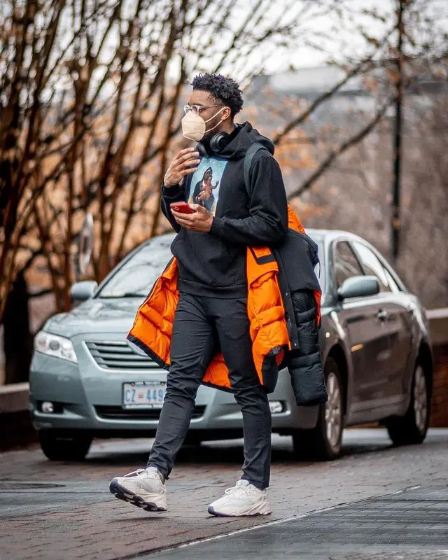 Donovan Mitchell outfit in Adidas, Louis Vuitton, and Retrosuperfuture, 2021