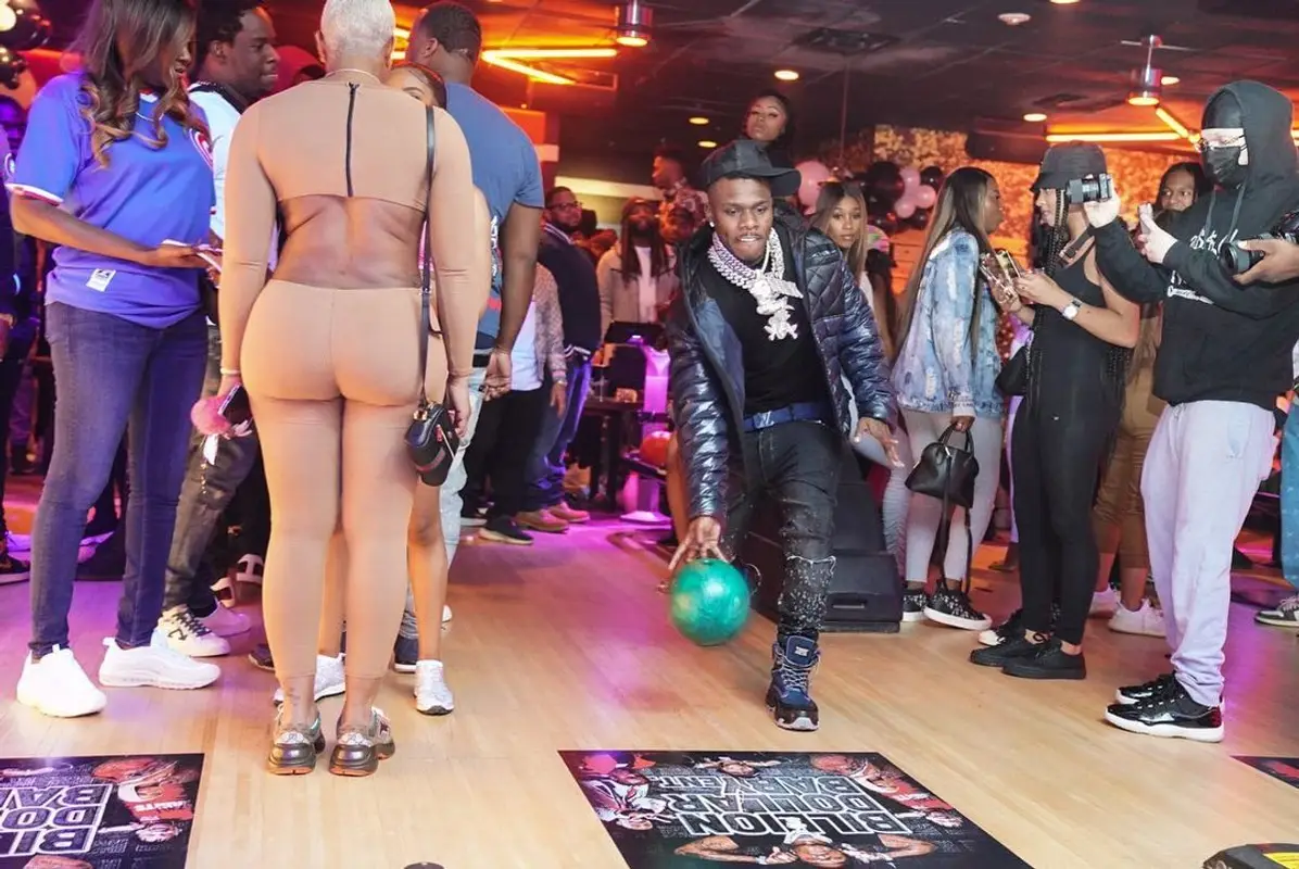 DaBaby outfit in Burberry, Louis Vuitton, and Amiri, 2021