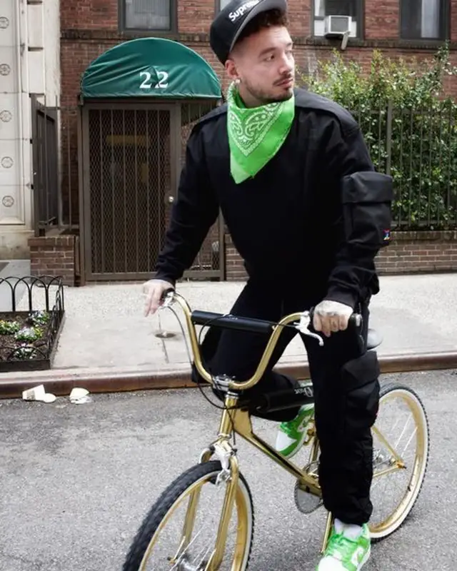 J Balvin outfit in Louis Vuitton, Supreme, and New Era, 2021