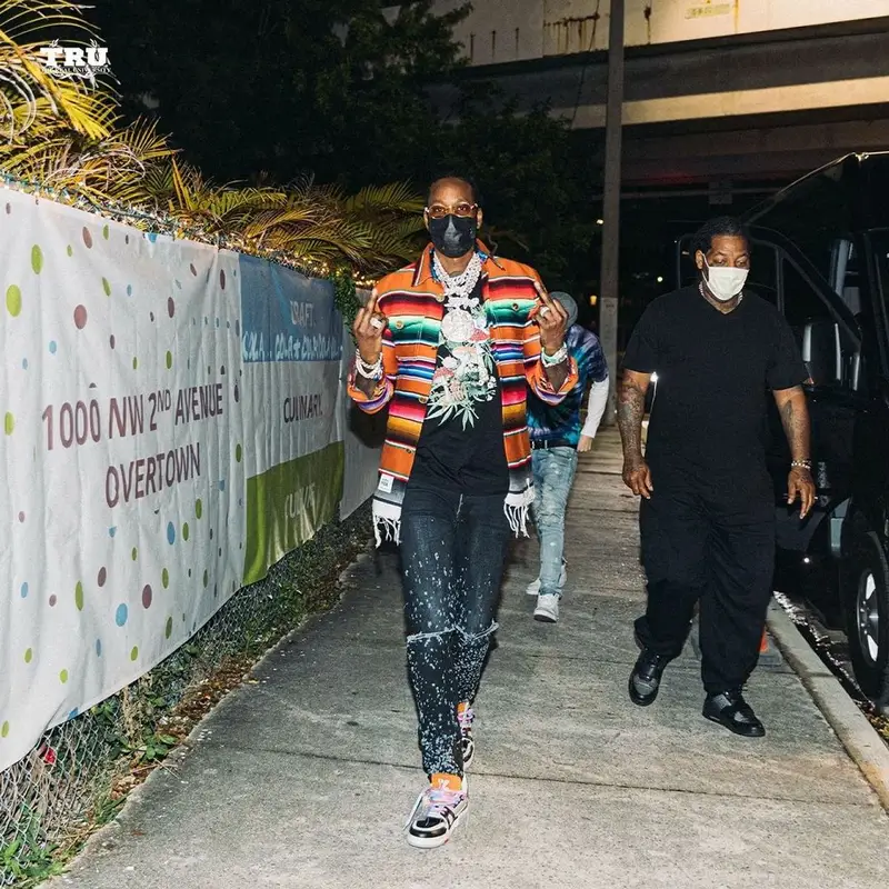 2 Chainz outfit in Amiri, Louis Vuitton, and Cartier, 2021
