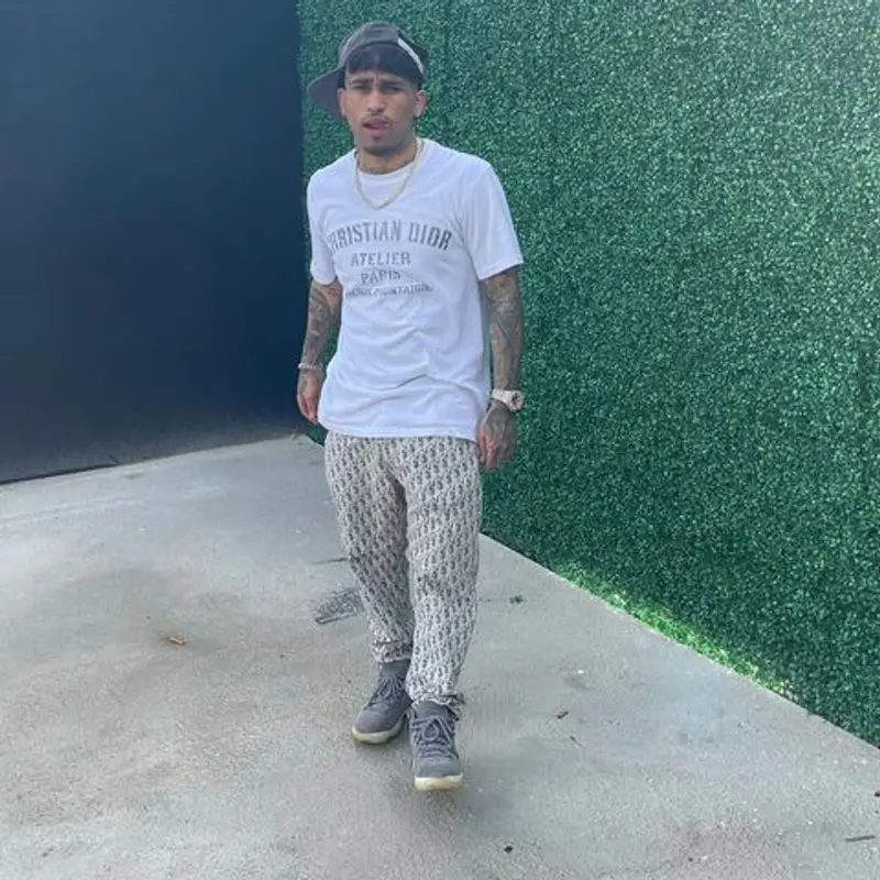 Bryant Mayers outfit in Dior, Jordan, and Mitchell & Ness, 2021