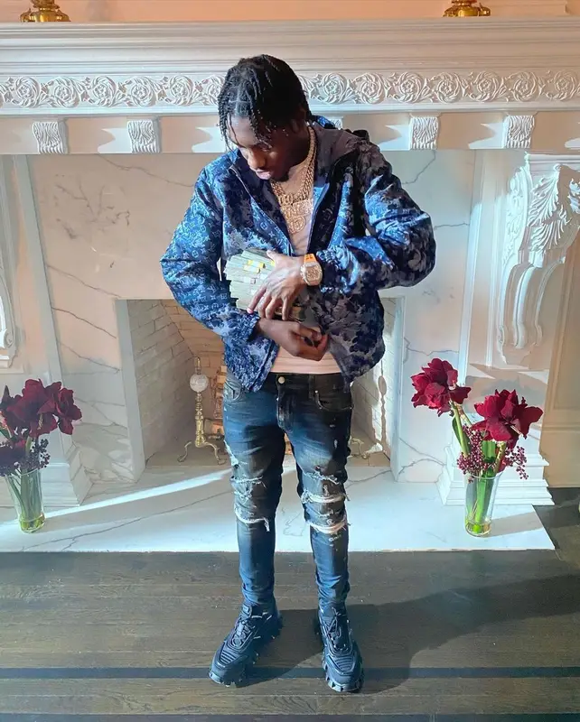 Lil Tjay outfit in Louis Vuitton, Amiri, and Prada, 2021