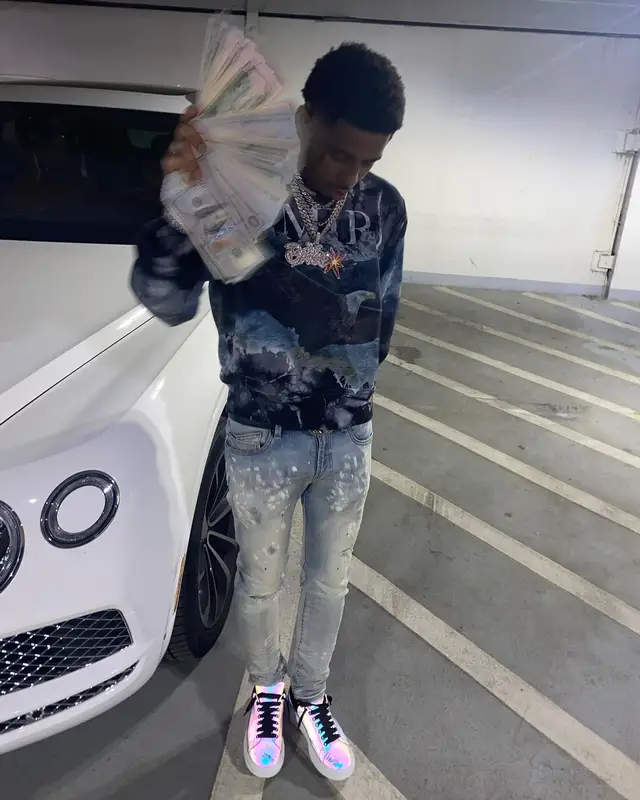 Pooh Shiesty outfit in Amiri, Purple Brand, and Gucci, 2021