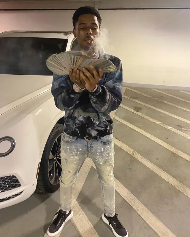 Pooh Shiesty outfit in Amiri, Purple Brand, and Gucci, 2021