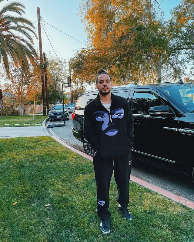 Russ outfit in Puma, Golden Goose, and KidSuper, 2021