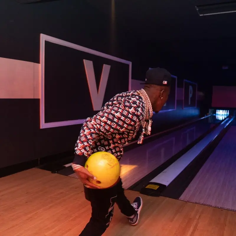 DaBaby outfit in Louis Vuitton, Amiri, and New Era, 2021