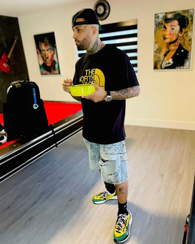 Nicky Jam outfit in Gucci, Amiri, and The North Face, 2021