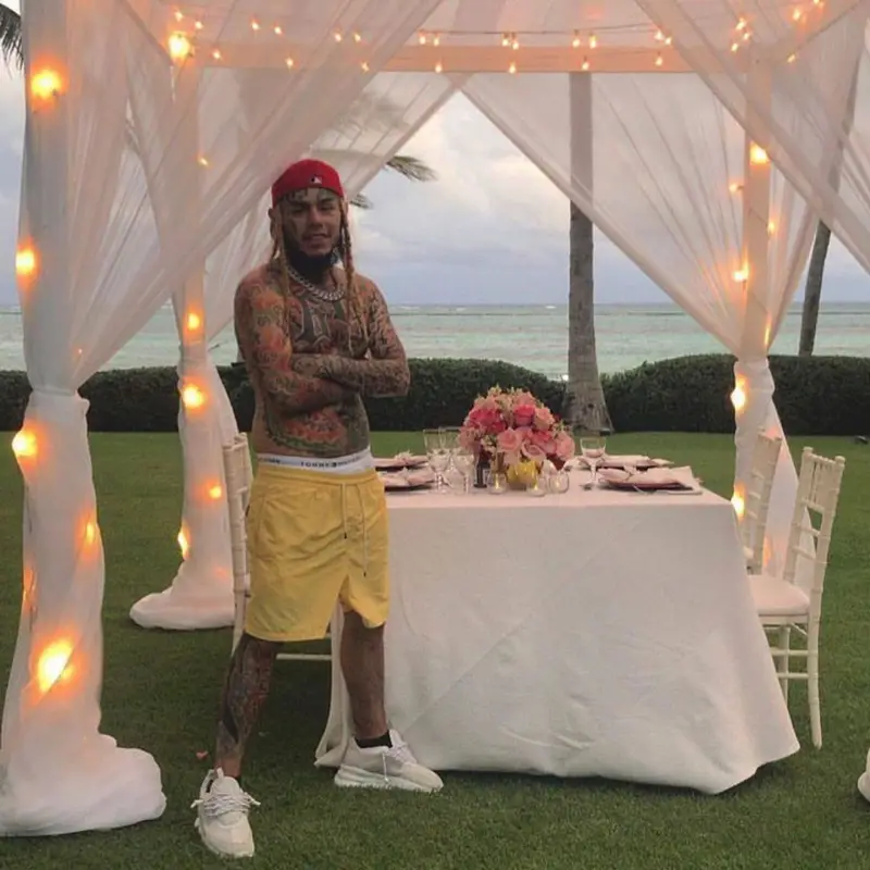 6ix9ine outfit in Polo Ralph Lauren, Tommy Hilfiger, and Nike, 2021