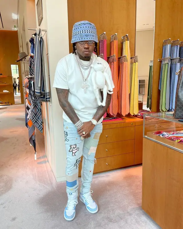 Gunna outfit in Louis Vuitton, Cartier, and Alanui, 2021