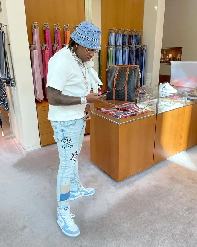 Gunna outfit in Louis Vuitton, Cartier, and Alanui, 2021