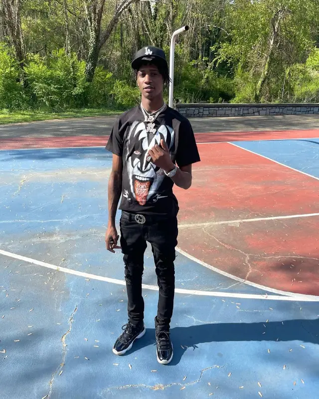 Yung Mal outfit in Jordan, Gucci, and New Era, 2021