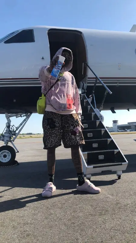 2 Chainz outfit in Amiri, Louis Vuitton, and Cartier, 2021