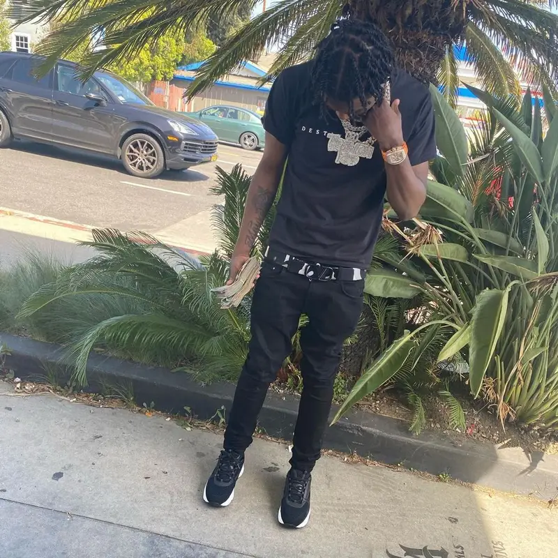 Lil Tjay outfit in Amiri, Dior, and Valentino, 2021