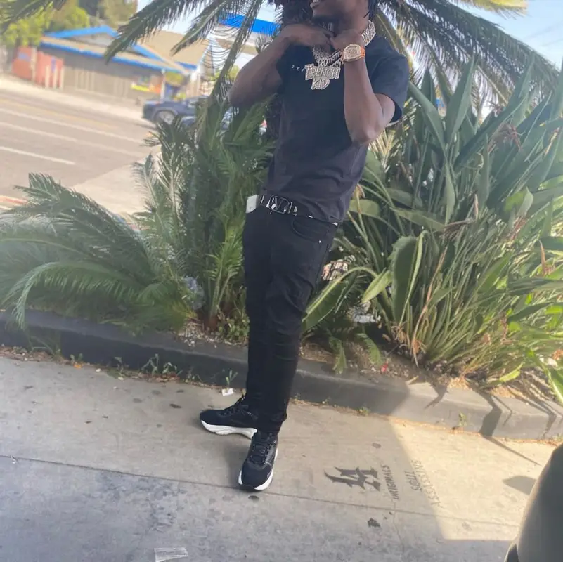 Lil Tjay outfit in Amiri, Dior, and Valentino, 2021