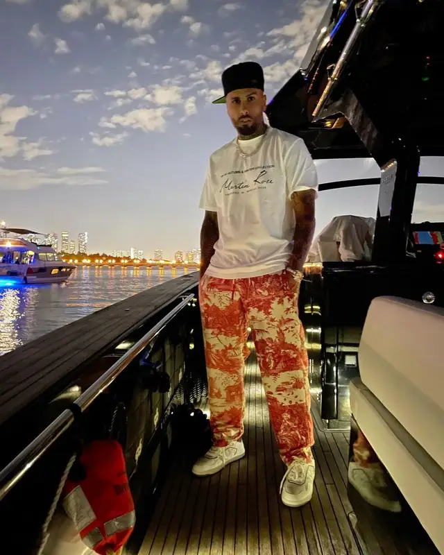 Nicky Jam outfit in Martine Rose, Pierre Louis Mascia, and Dior, 2021