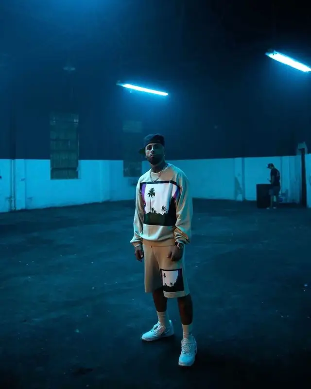 Nicky Jam outfit in Dries Van Noten, Nike, and Travis Scott Merch, 2021