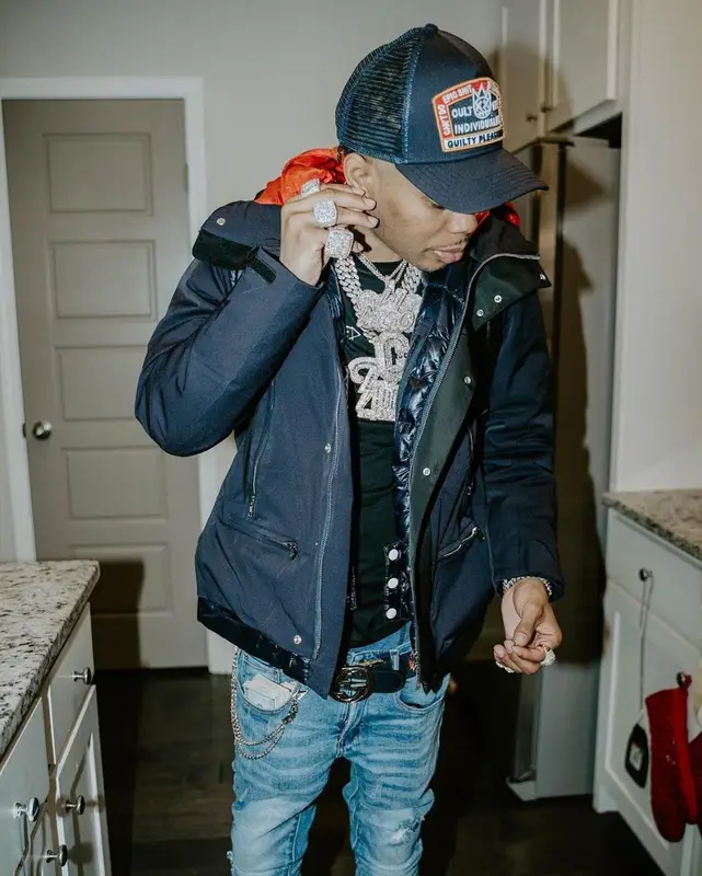 Lil Migo outfit in Chanel, Gucci, and Cult of Individuality, 2021