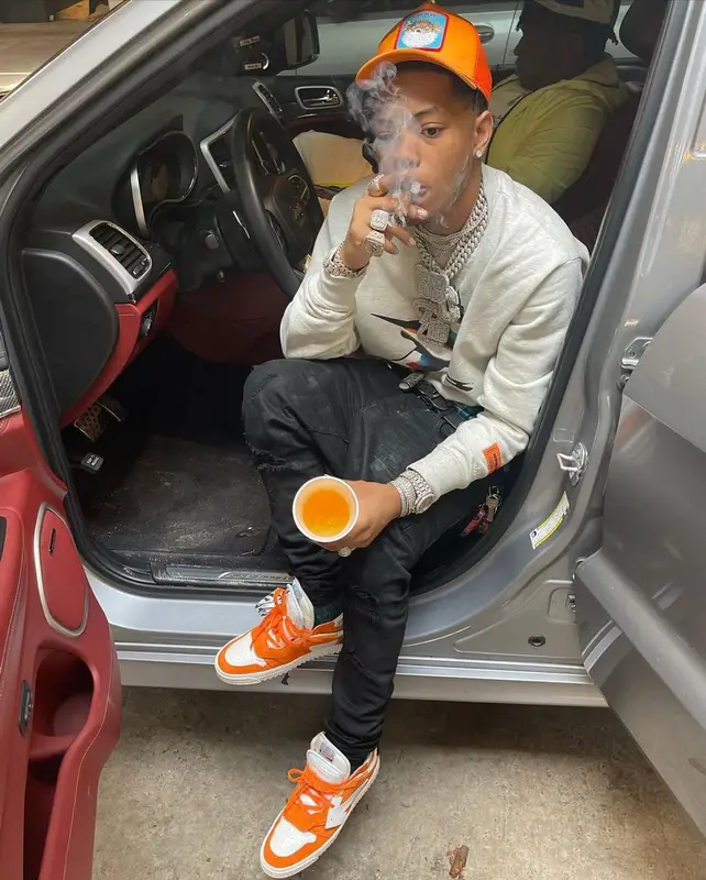 Lil Migo outfit in Heron Preston, Brioni, and Goorin Bros, 2021