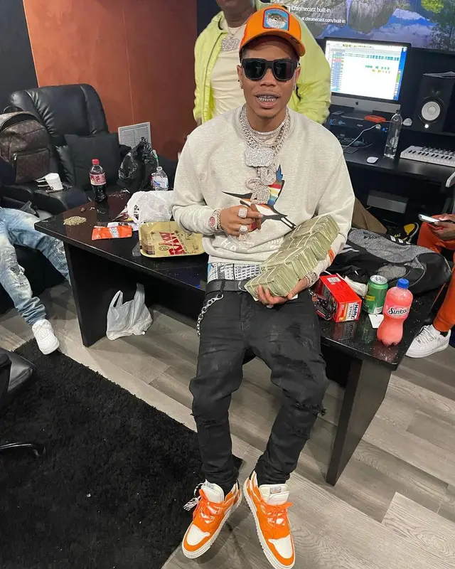 Lil Migo outfit in Heron Preston, Brioni, and Goorin Bros, 2021
