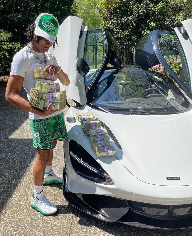 Lil Baby outfit in Amiri, Jordan, and Von Dutch, 2021