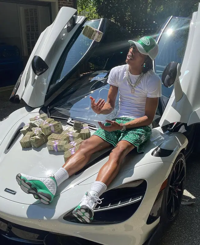 Lil Baby outfit in Amiri, Jordan, and Von Dutch, 2021