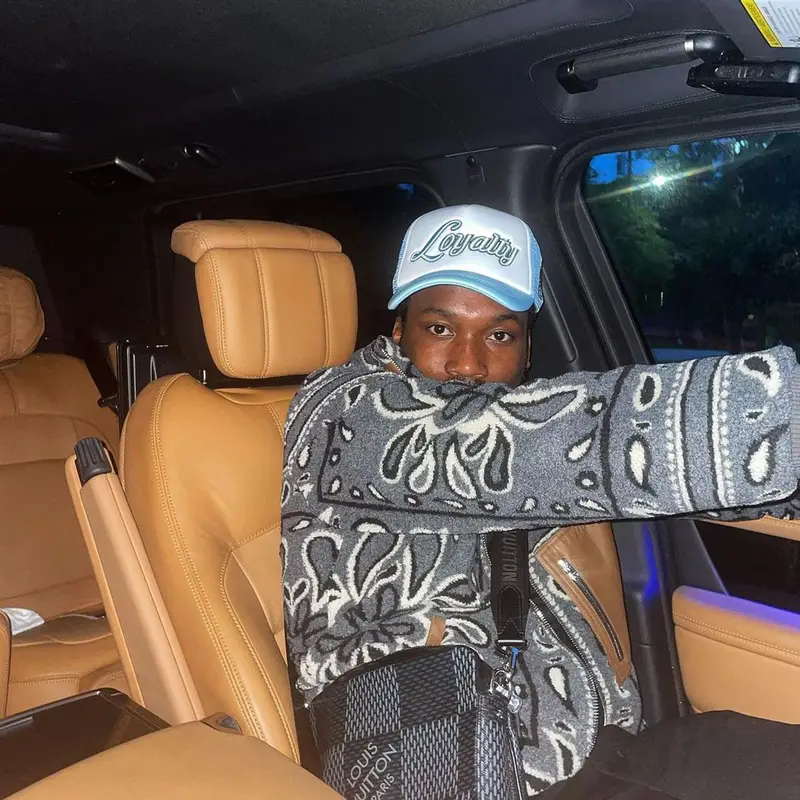 Meek Mill outfit in Amiri, Louis Vuitton, and Homme + Femme, 2021