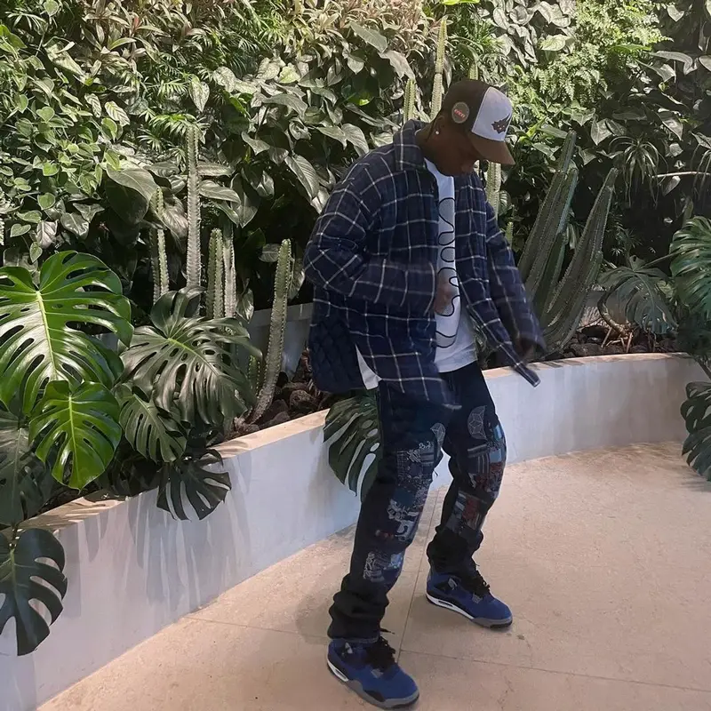 Travis Scott outfit in Balenciaga, Kapital, and Travis Scott Merch, 2021