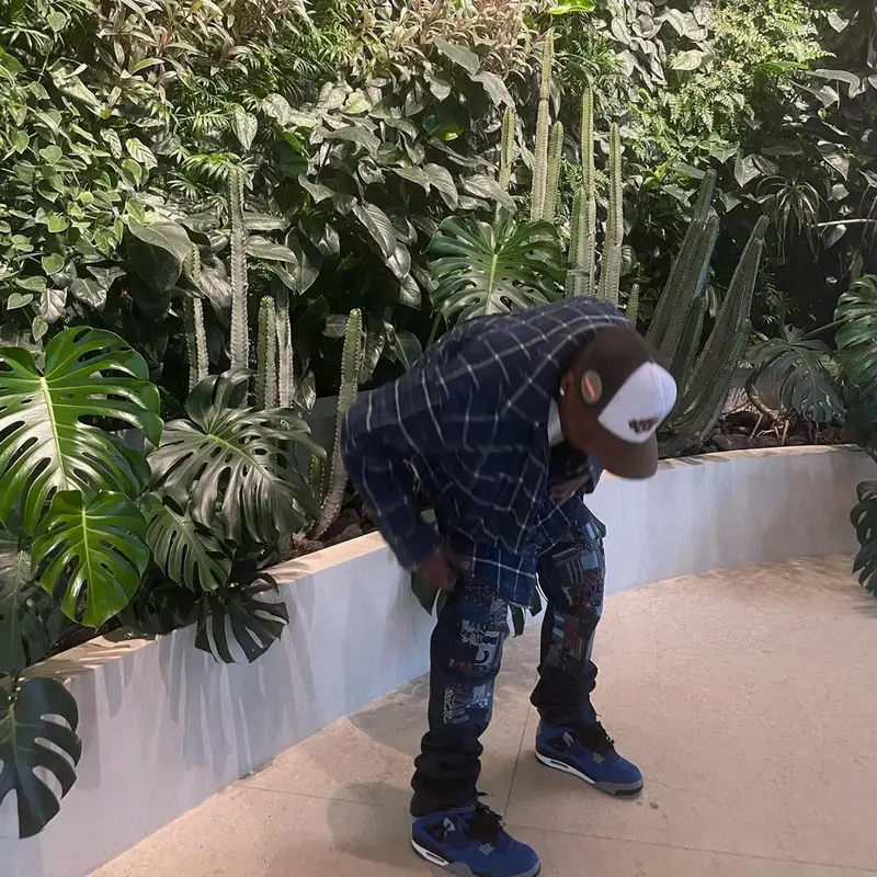 Travis Scott outfit in Balenciaga, Kapital, and Travis Scott Merch, 2021