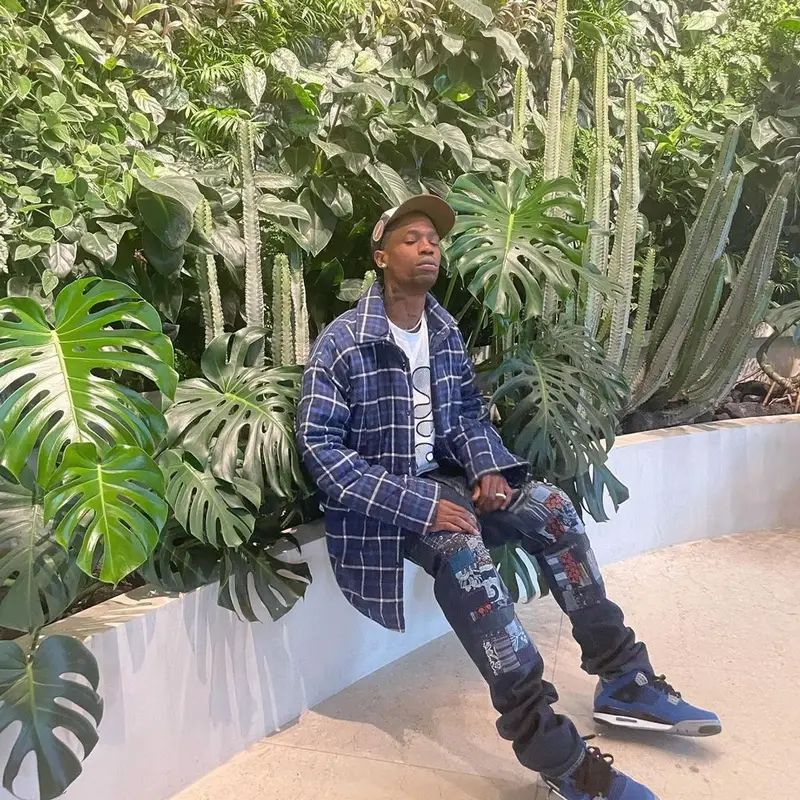 Travis Scott outfit in Balenciaga, Kapital, and Travis Scott Merch, 2021
