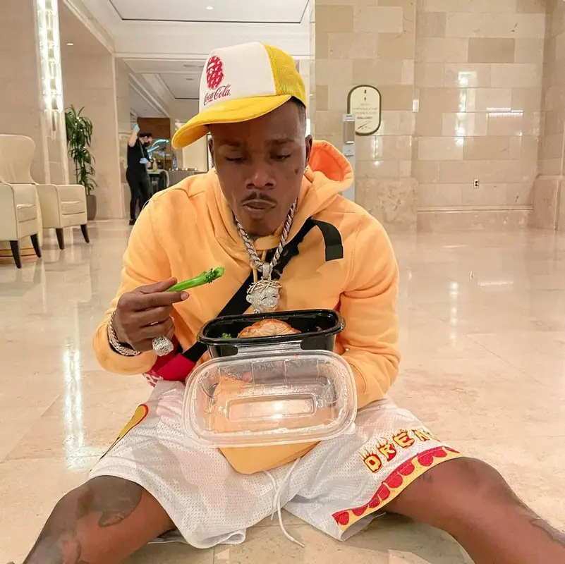 DaBaby outfit in Burberry, Bape, and Coca-Cola, 2021