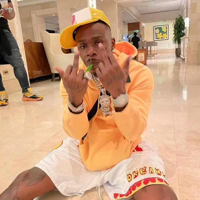 DaBaby outfit in Burberry, Bape, and Coca-Cola, 2021