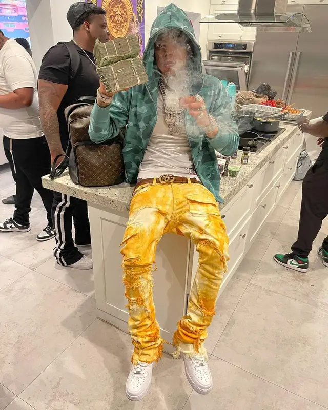 Lil Migo outfit in Tulones, Bape, and Gucci, 2021