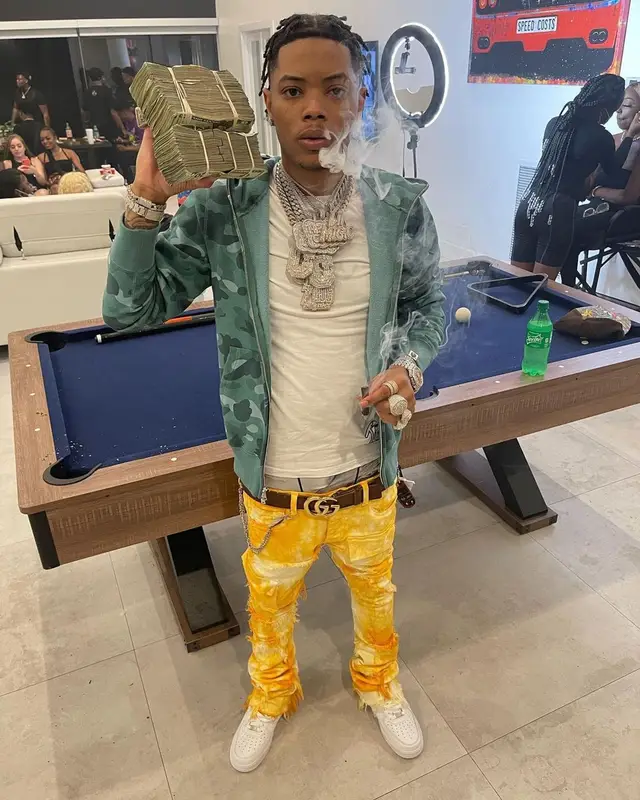 Lil Migo outfit in Tulones, Bape, and Gucci, 2021