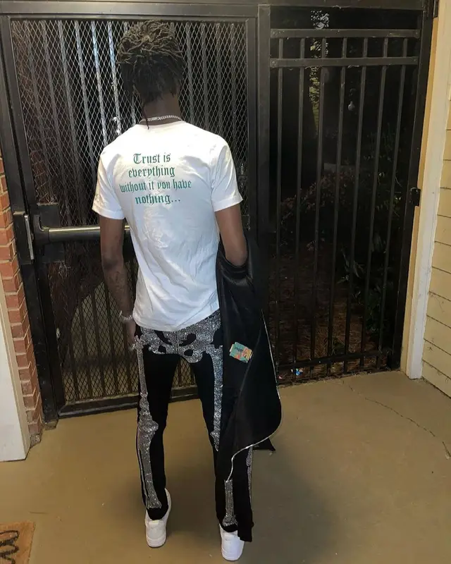 Yung Mal outfit in 21 Envy, Klan Life, and Nike, 2021